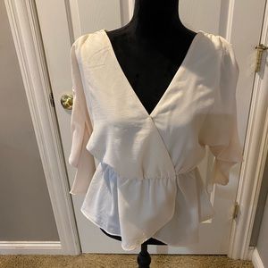 This top is so pretty on but was too small for me. It is so angelic and whispy.